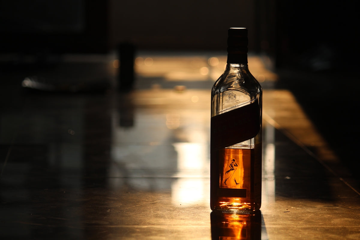 a bottle of alcohol sitting on top of a table